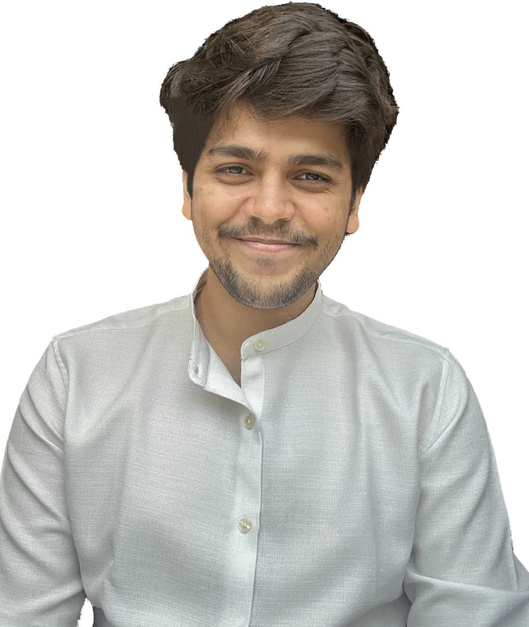 Aditya Rai, smiling, in a white kurta